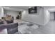 Finished basement showcasing sitting area, bar, and neutral flooring at 3714 Turfway Ct, Indianapolis, IN 46228