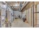 Unfinished basement with water heater, utilities, and concrete floor at 3714 Turfway Ct, Indianapolis, IN 46228