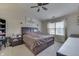 Bright bedroom featuring a ceiling fan, vaulted ceiling, and a window with natural light at 3714 Turfway Ct, Indianapolis, IN 46228