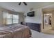 This bedroom has built in drawers, a window for natural light and a ceiling fan at 3714 Turfway Ct, Indianapolis, IN 46228