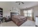 Spacious bedroom features a ceiling fan, vaulted ceiling, and a window with natural light at 3714 Turfway Ct, Indianapolis, IN 46228