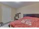 Bedroom featuring neutral walls, white door and trim, and laminate flooring at 3714 Turfway Ct, Indianapolis, IN 46228