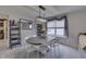 Charming dining room featuring modern lighting, neutral decor, and a gray table with seating for six at 3714 Turfway Ct, Indianapolis, IN 46228