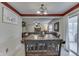 Open concept dining area with traditional cabinets and view of living room with fireplace at 3714 Turfway Ct, Indianapolis, IN 46228