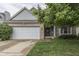 Charming brick and siding home with an attached garage and mature landscaping at 3714 Turfway Ct, Indianapolis, IN 46228
