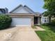 Charming single-Gathering home with well-maintained landscaping, a two-car garage, and a welcoming entrance at 3714 Turfway Ct, Indianapolis, IN 46228