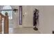 Foyer featuring tile floors, coat rack, and natural light from the nearby window at 3714 Turfway Ct, Indianapolis, IN 46228