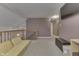 Bright upstairs hallway features contemporary carpet, neutral paint, and a wooden banister overlooking the living area below at 3714 Turfway Ct, Indianapolis, IN 46228