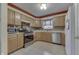 Cozy kitchen featuring stainless steel appliances, wood cabinets, and ample counter space at 3714 Turfway Ct, Indianapolis, IN 46228