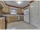 Bright kitchen with wood cabinets, stainless appliances, tile backsplash, and tile flooring at 3714 Turfway Ct, Indianapolis, IN 46228
