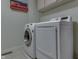 A modern laundry room featuring a front-loading washing machine and dryer at 3714 Turfway Ct, Indianapolis, IN 46228