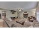 Inviting living room with fireplace, TV, ceiling fan, and comfortable seating for relaxation at 3714 Turfway Ct, Indianapolis, IN 46228