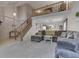 Open concept living room featuring staircase and comfortable seating at 3714 Turfway Ct, Indianapolis, IN 46228