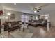 Spacious living room with a ceiling fan, natural light, and comfortable brown sofa at 3714 Turfway Ct, Indianapolis, IN 46228