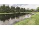 Pond surrounded by lush greenery and trees, reflecting a calm and serene atmosphere at 3714 Turfway Ct, Indianapolis, IN 46228