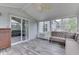 Bright sunroom featuring sliding glass doors, neutral paint and vinyl flooring at 3714 Turfway Ct, Indianapolis, IN 46228