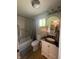 The bathroom contains a vanity and a shower at 421 W Hendricks St, Shelbyville, IN 46176