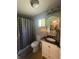 The bathroom contains a vanity and a shower at 421 W Hendricks St, Shelbyville, IN 46176