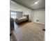 Comfortable bedroom featuring neutral decor, a large window, and spacious closet at 421 W Hendricks St, Shelbyville, IN 46176