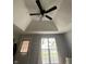 Bright bedroom featuring vaulted ceilings, natural light, and tasteful decor for a comfortable personal space at 421 W Hendricks St, Shelbyville, IN 46176