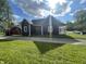 Exterior shot showcasing the home's architecture, landscaping, and curb appeal for a picturesque view at 421 W Hendricks St, Shelbyville, IN 46176