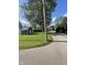 Landscaped view showing the home and a large backyard shed with alley access, providing a comfortable outdoor space at 421 W Hendricks St, Shelbyville, IN 46176