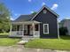 Charming two-story home with a welcoming front porch and a well-maintained lawn, perfect for curb appeal at 421 W Hendricks St, Shelbyville, IN 46176