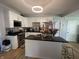 Bright kitchen featuring modern white cabinets, stainless appliances, and island with seating at 421 W Hendricks St, Shelbyville, IN 46176