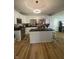 Bright kitchen featuring modern white cabinets, stainless appliances, and island with seating at 421 W Hendricks St, Shelbyville, IN 46176