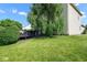 Landscaped backyard featuring an elevated deck and mature trees at 4342 Sequoia Ct, Greenwood, IN 46143