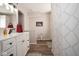 Modern bathroom featuring a white vanity, decorative mirror, and patterned shower curtain at 4342 Sequoia Ct, Greenwood, IN 46143