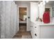 Elegant bathroom featuring a white vanity and wood look flooring at 4342 Sequoia Ct, Greenwood, IN 46143