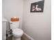Cozy half bathroom featuring toilet and modern art at 4342 Sequoia Ct, Greenwood, IN 46143