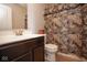 Bathroom with dark vanity, toilet, and patterned shower curtain at 4342 Sequoia Ct, Greenwood, IN 46143