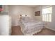 Neutral bedroom with gray bedding and a window bringing in natural light at 4342 Sequoia Ct, Greenwood, IN 46143