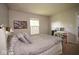 Neutral bedroom with gray bedding, a window, and white shelving at 4342 Sequoia Ct, Greenwood, IN 46143