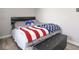 Bedroom with wooden floors and American flag throw blanket at 4342 Sequoia Ct, Greenwood, IN 46143