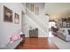 Welcoming entryway with staircase, hardwood floors, and view into the dining room at 4342 Sequoia Ct, Greenwood, IN 46143