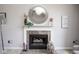 Bright living space featuring a fireplace with decorative mirror and vases above the mantel at 4342 Sequoia Ct, Greenwood, IN 46143