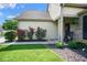 Cozy front porch featuring decorative plants, a flower wreath, and brick accents creating a welcoming entrance at 4342 Sequoia Ct, Greenwood, IN 46143