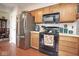 Kitchen features stainless steel refrigerator and black oven at 4342 Sequoia Ct, Greenwood, IN 46143