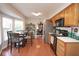 Open kitchen with stainless steel refrigerator and eat in dining room at 4342 Sequoia Ct, Greenwood, IN 46143