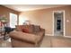 Living room with brown sofa, carpet, and large windows at 4342 Sequoia Ct, Greenwood, IN 46143
