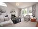 Bright living room with a fireplace, comfortable seating, large windows, and stylish decor at 4342 Sequoia Ct, Greenwood, IN 46143