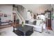 Bright living room open to the dining area with a large sofa and decorative accents at 4342 Sequoia Ct, Greenwood, IN 46143