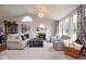 Spacious living room with a fireplace, large windows, comfortable seating, and tasteful decor at 4342 Sequoia Ct, Greenwood, IN 46143