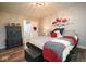 Bedroom showcases decorative bed, attractive light fixture and wood look flooring at 4342 Sequoia Ct, Greenwood, IN 46143