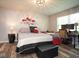 Comfortable bedroom featuring a decorative bed, workstation, and wood look flooring at 4342 Sequoia Ct, Greenwood, IN 46143