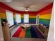 Colorful classroom with rainbow-themed walls, creating a vibrant and stimulating learning environment at 4402 E New York St, Indianapolis, IN 46201