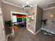 Bright hallway with colorful accents and unique decor, offering a cheerful and playful atmosphere at 4402 E New York St, Indianapolis, IN 46201